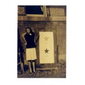 LaVonne Rasmussen with I.O.O.F. Home war service banner, 1943
